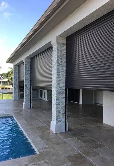 Motorized roll-down storm shutters on a lanai in Naples – Shutter Specialists