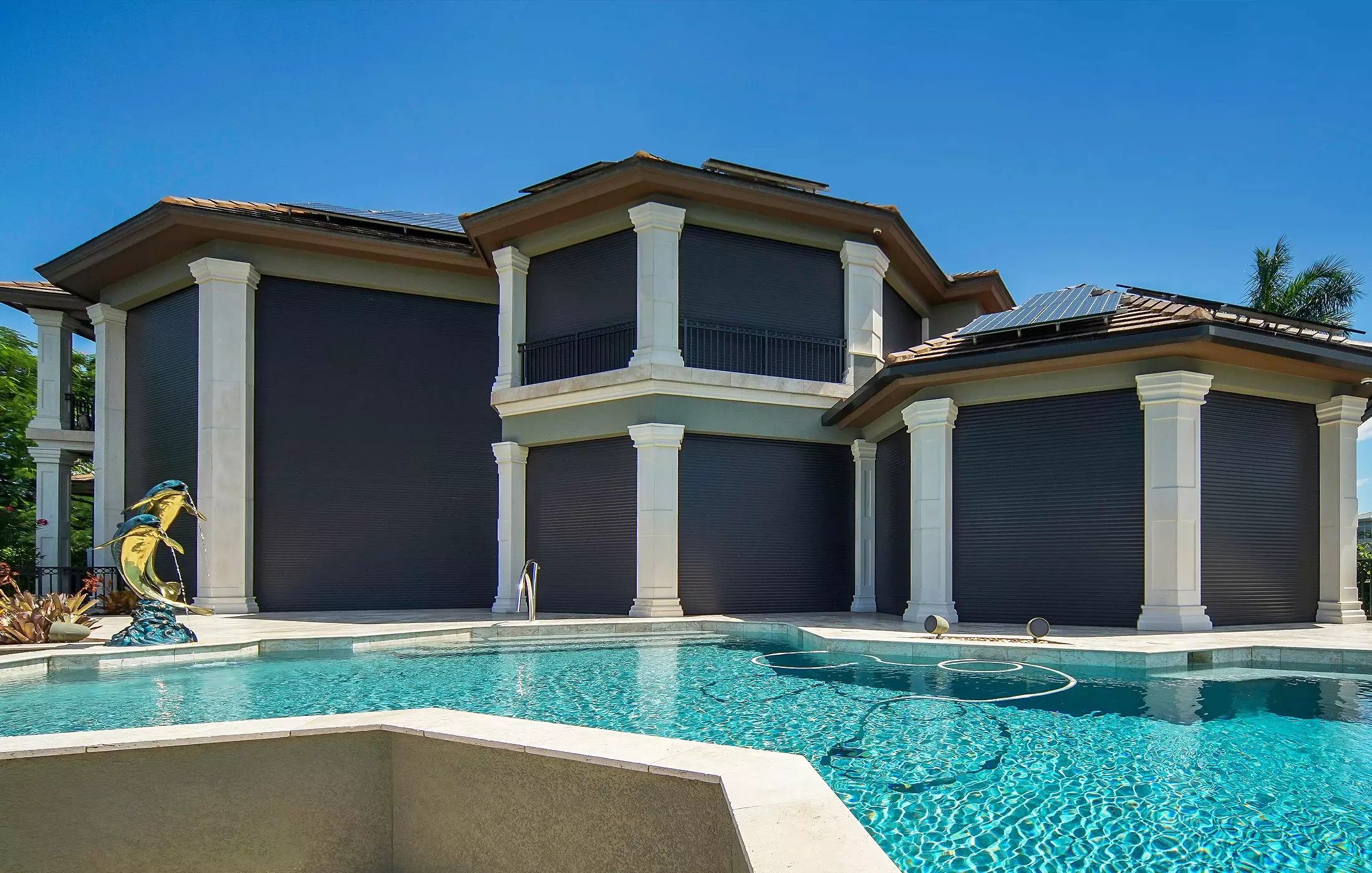 Custom roll-down hurricane shutters on a home in Cape Coral &ndash; Shutter Specialists